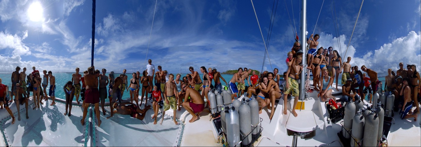 Odyssey Students on front of catamaran
