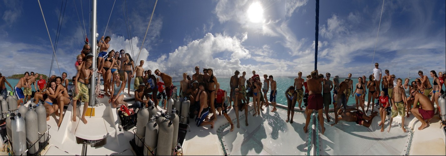 Odyssey Expeditions students on front of Moorings catamaran in the Tobogo Keys, Grenadines